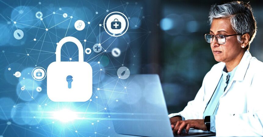 Healthcare professional working on a laptop related to cybersecurity