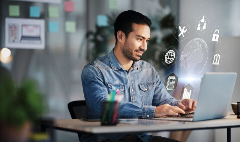 Businessman, laptop and cybersecurity overlay with futuristic hologram, data safety or software developer in office with innovation of technology